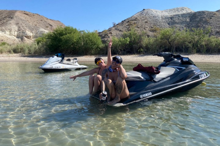 Two Jet Ski and Women in a body of water